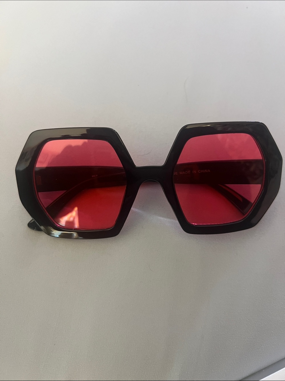 Women’s Black Frame Sunglasses with Red Lenses
